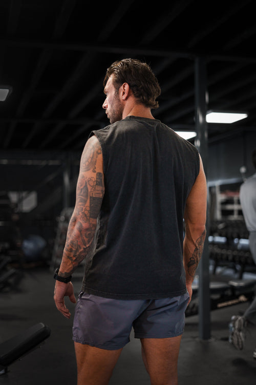 Back view of the washed-black S20 End of Summer Vest showing the drop-armhole cut and shoulder fit